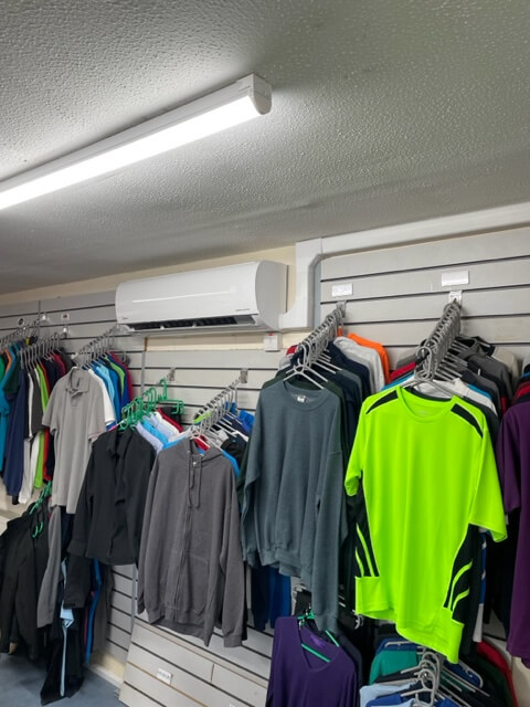 Air conditioning unit on a wall in a clothing showroom