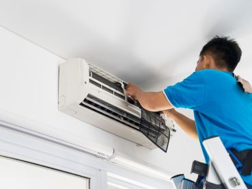 man repairing air conditioning