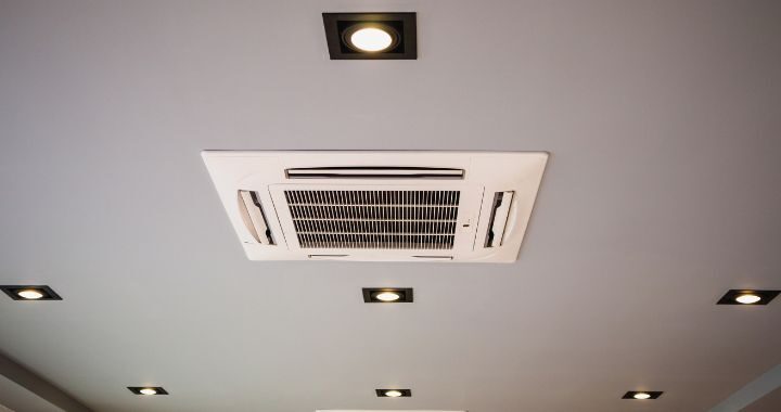 Air conditioning ceiling cassette surrounded by lights