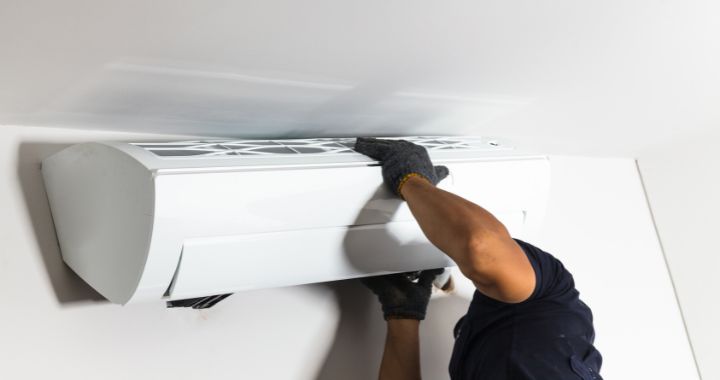 Technician installing a new air conditioning unit