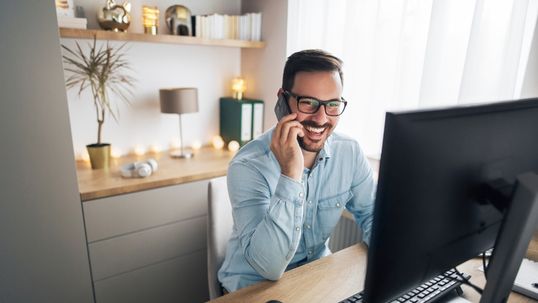man on a phone call in home office